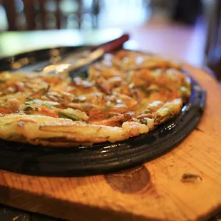 a pizza on a cutting board