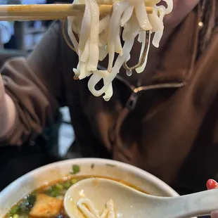 Not the pho noodles you normally get at Pho joints. This is rice noodles made in-house (super hard and broken up into small pieces)