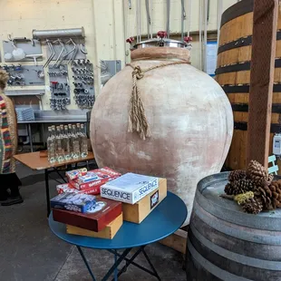 a barrel of wine and a table with books