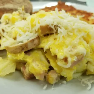 Countryside Scrambler. 2 eggs scrambled with ham, sauteed mushrooms and onions, and topped with Jack cheese.