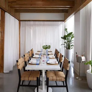 a dining room with a table and chairs