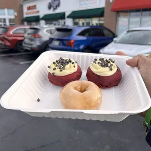 Red velvet donuts and a normal glazed donut