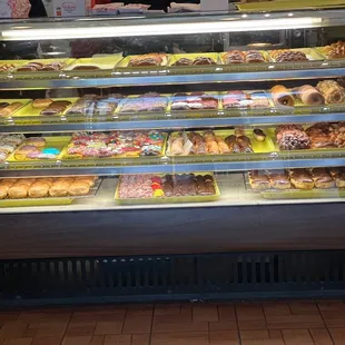 a display case filled with donuts
