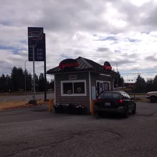 a car parked in front of a restaurant