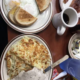 Country fried steak and eggs with hashbrowns and ye toast.