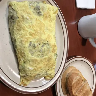 Corned Beef Hash omelette with onions and mushrooms. So Good!