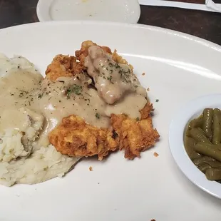 Chicken fried chicken, green beans, mashed potatoes