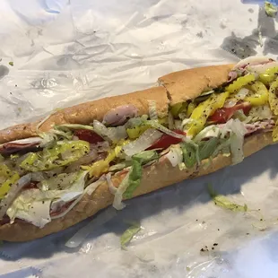 a sub sandwich with toppings