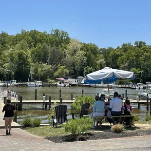 a group of people sitting at a picnic table