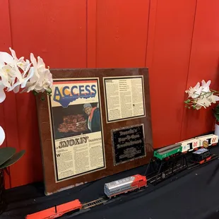 a table with a train set and a menu