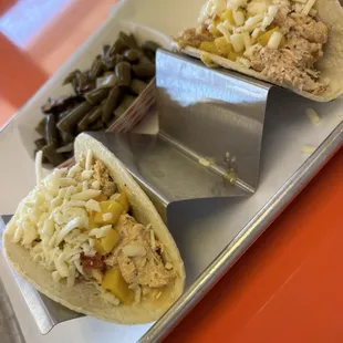 Chicken Salad Tacos-house made chicken salad, mango pico, white cheddar cheese with smoked green beans