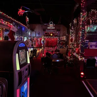 the inside of a restaurant decorated for christmas