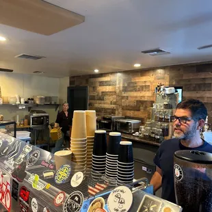 a man standing in a coffee shop