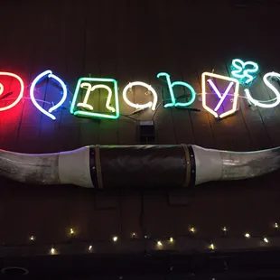 a horn and neon sign