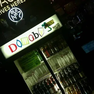 a neon sign in the background