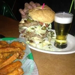 a plate of food and a glass of beer