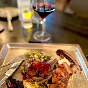 Seared Duck Breast &amp; Confit Leg .. honey teriyaki, with a berry compote on top of Charred Brussels ... melt in your mouth deliciousness!