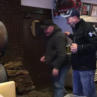 The owners son stoking the heater