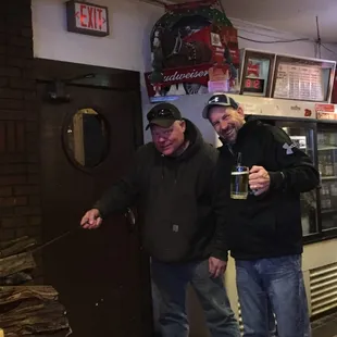 two men standing in front of a door
