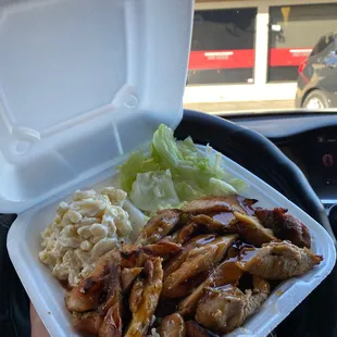 Chicken teriyaki plate with creamy macaroni salad and a side of crisp regressing lettuce