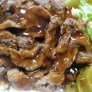 a plate of meat and vegetables