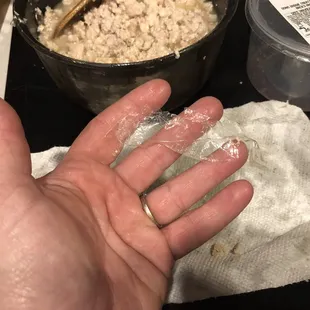a person's hand covered in flour