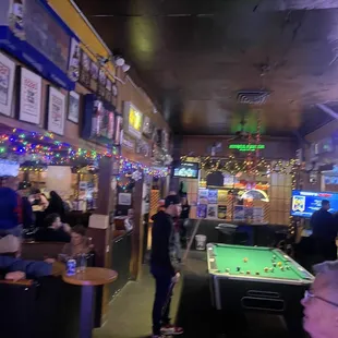 a pool table in the middle of the room