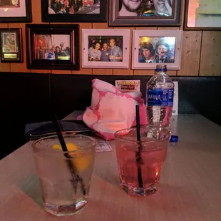 a glass of water and a glass of lemonade