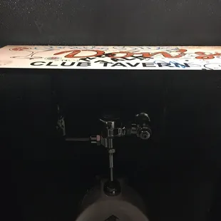 Huge shelf over urinal!