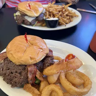 Blue cheese dressing underneath bacon burger foreground and portabella burger background.