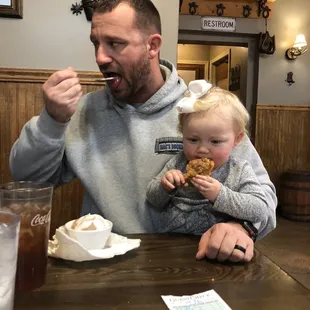 a man and child eating