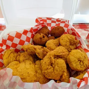 #14 - Four fish pieces. Ten medium shrimp. Hush puppies and a roll.