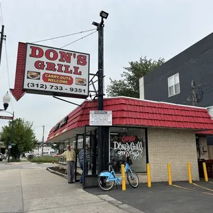 a bicycle parked in front of a restaurant