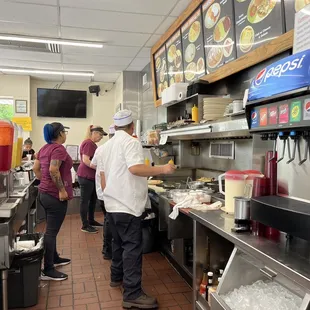 a group of people preparing food