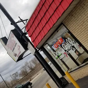 a car parked in front of a restaurant