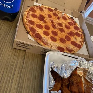 Small special of 14in(they might have done bigger ) , 10 wings and a 2 liter of Pepsi