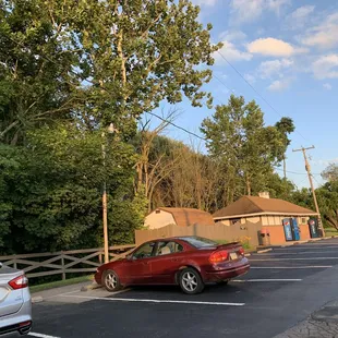 a red car in a parking lot