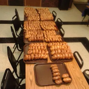 a long table full of donuts