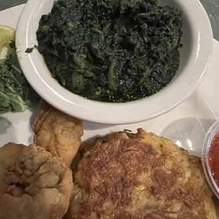 Crabcake and fried oysters with turnip greens