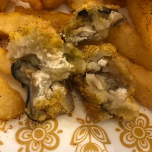 a plate of fried fish and chips