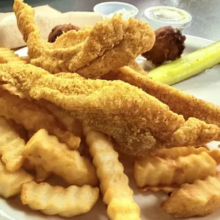 3 pieces of fried catfish fries and hush puppies