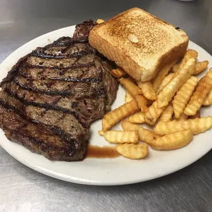 12 oz Ribeye dinner (comes with one trip to salad bar)