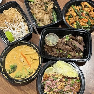 the spread - pad thai, pad see ew, donsak chicken, pork neck, nam khao, panang (clockwise from top left)   @davideatsdc