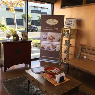 a coffee table with a sign on it