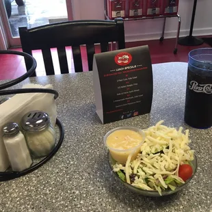 Salad and drink as part of the lunch #1 special ... (pizza slices were still in the oven) ...