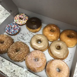 a variety of donuts in a box