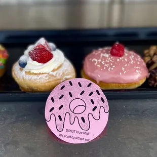 donuts with pink frosting and sprinkles