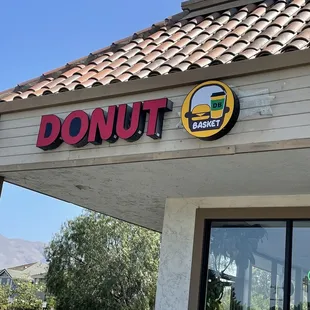 a donut shop with a sign above the door