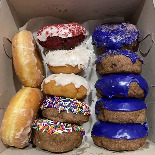 Mixed dozen - ube donuts on the right