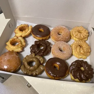 Old fashions, glazed donuts, sugar donuts, crullers, and one lonely raspberry jelly donut